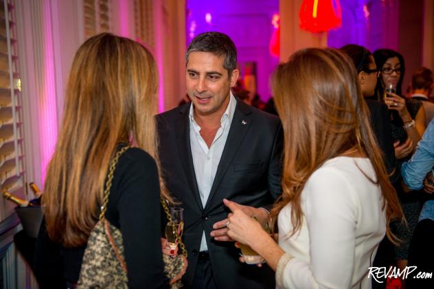 Newly appointed W Washington, D.C. hotel General Manager Olivier Servat chats with guests during yesterday's reception.